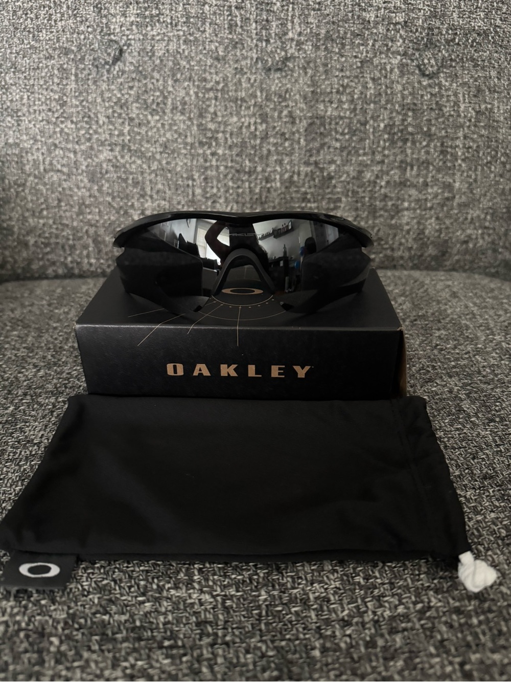 Oakley women’s Black Wrapped Sports Sunglasses with Mirrored Lenses